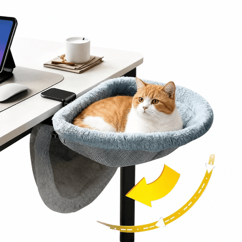 Foldable Cat Desk Bed with faux fur lining and folding frame mounted on the edge of a work-from-home desk, the WFH cat office perch