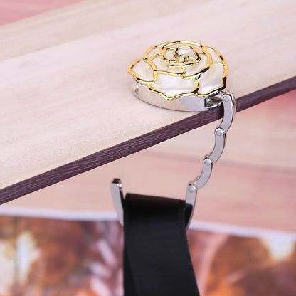 Foldable bag hanger supporting heavy leather purse at restaurant table - SBDS WORD Canada